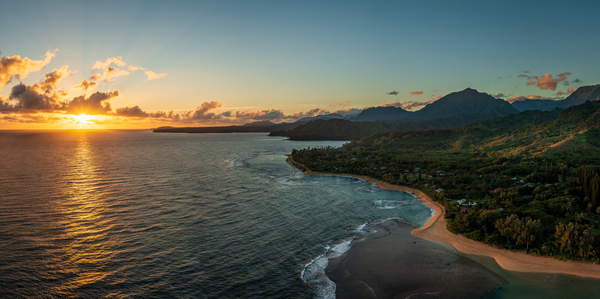 Widescreen panorama of sunrise over Tunnels Beach Kauai Hawaii by Steve Heap