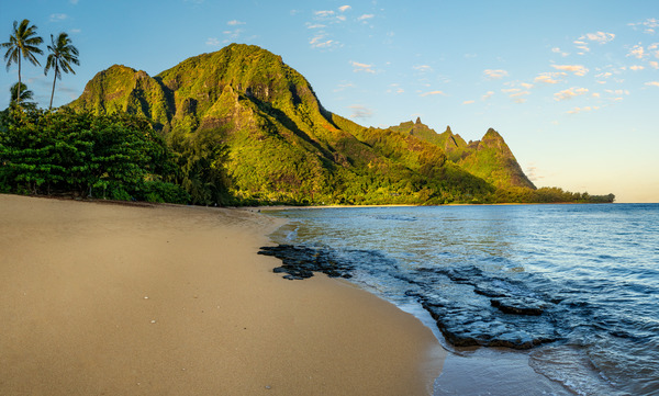Early morning sunrise over Tunnels Beach on Kauai in Hawaii Print