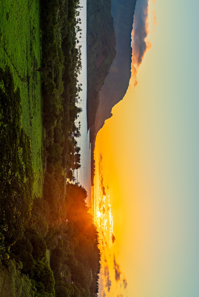 Sunset over Hanalei bay from overlook on the road Print