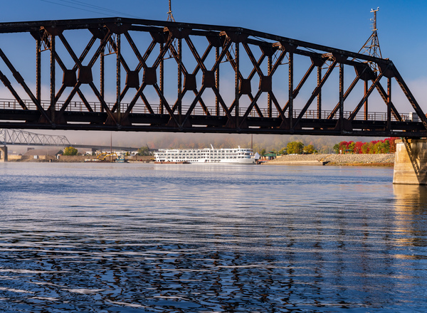 River cruise boat docked in Dubuque IA under Railroad bridge by Steve Heap