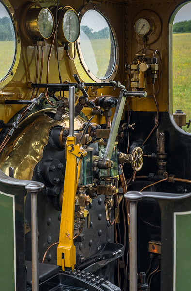 Detail of the driver cabin and controls on an old steam locomoti by Steve Heap