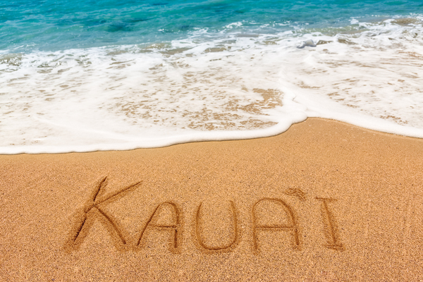 Kauai written in sandy beach by Steve Heap