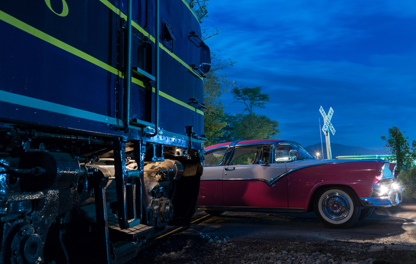 Vintage car racing at railroad crossing Print