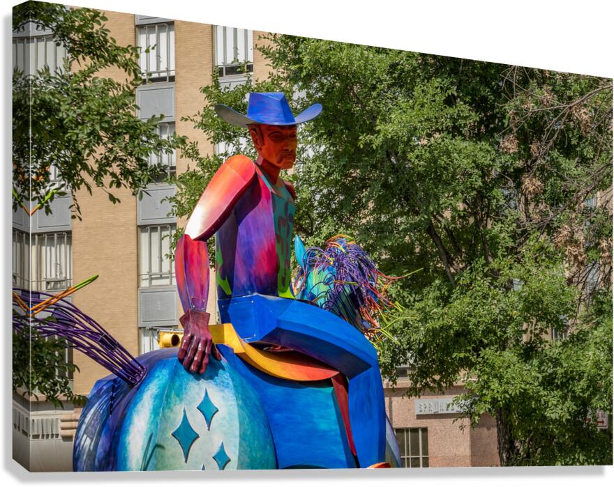 Tracking the end of the rainbow scuplture of cowboy on horse in  Canvas Print