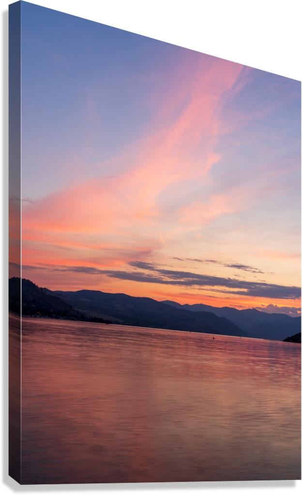 Sunset over Lake Chelan with dramatic sky reflected in long dura Canvas Print