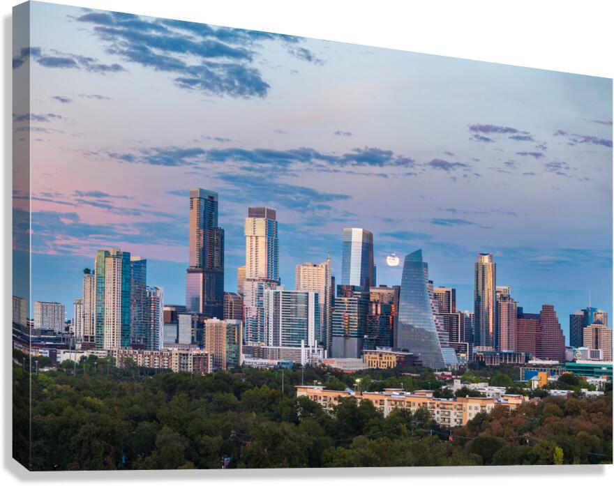 Distant view of Harvest moon in the Austin skyline at sunset Canvas Print