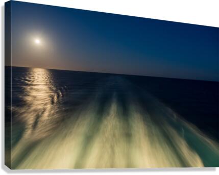 Moon over the wake of cruise ship travelling at speed Canvas Print