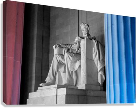 President Lincoln statue with pillars lit in red and blue Canvas Print