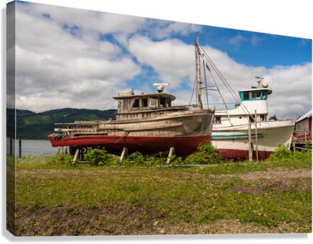 Historic but rotting fishing boats by ocean at Icy Strait Point Canvas Print