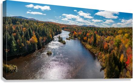 Saranac river flows through multi-colored fall landscape in Adir Canvas Print
