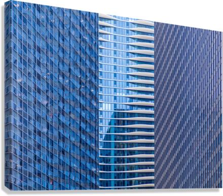 Distinctive hotel between skyscrapers Canvas Print