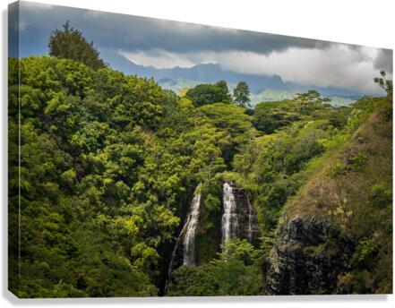 Opaekaa Falls sunlit as dark storm clouds gather over the hills Canvas Print