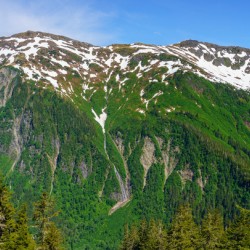 View from Mount Roberts toward Mt Juneau with waterfall in Alask