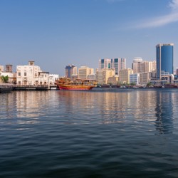 The Creek by Bur Dubai and Al Seef with large docked cruise boat