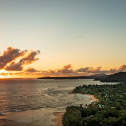 Broad panorama of sunrise over Tunnels Beach Kauai Hawaii