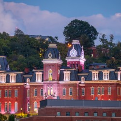 Woodburn Hall illuminated at dusk in Morgantown WV