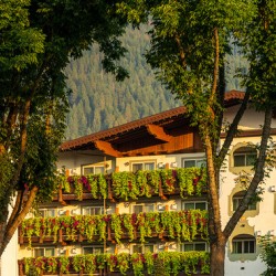 Flower strewn balconies of a hotel in Alpine village of Leavenwo