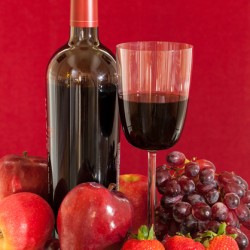 Red wine bottle and fruit with glass