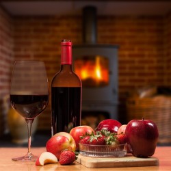 Red wine bottle and fruit with glass