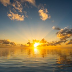 Beautiful sunset reflected in a calm peaceful ocean