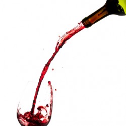 Wine pouring from bottle into glass