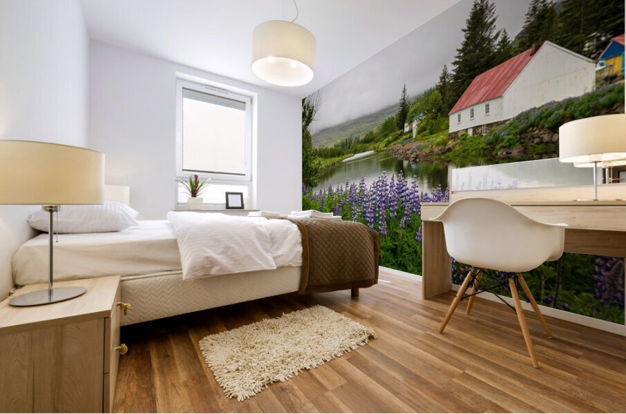 Peaceful scene in Seydisfjordur of river flowing from misty moun Mural print