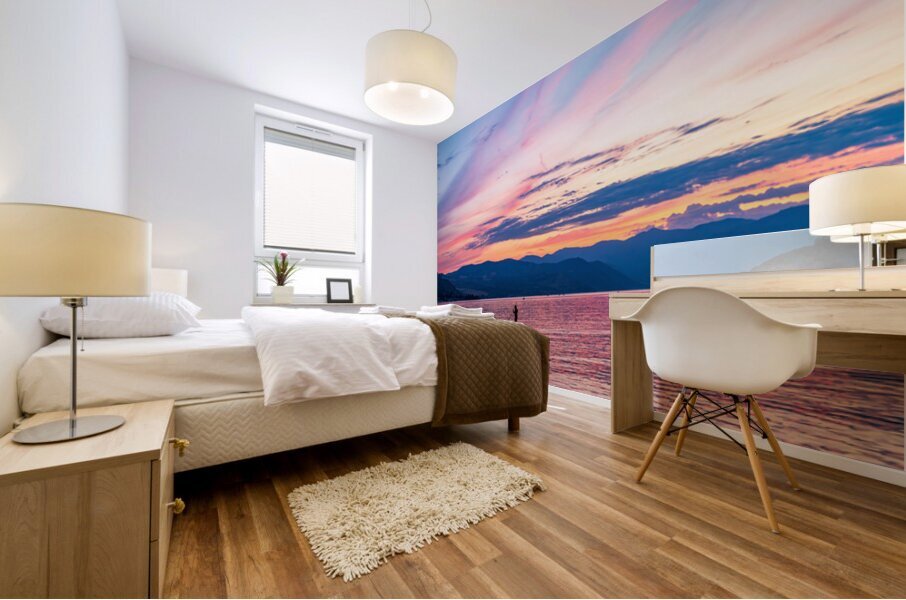 Sunset over Lake Chelan with silhouette of couple paddling on pa Mural print