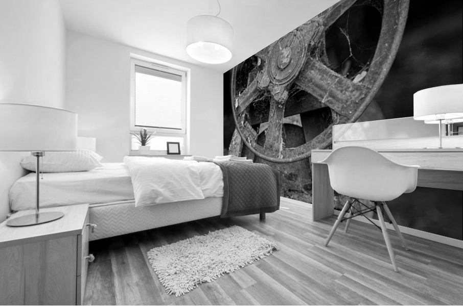 Rusty farm machinery with flywheel Mural print