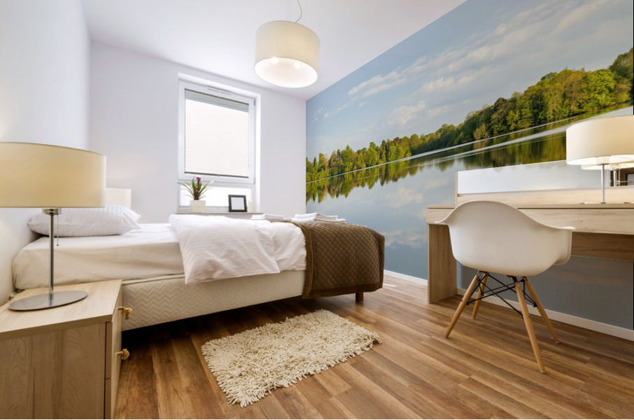 View across the Mere to a clear reflection of distant trees in E Mural print