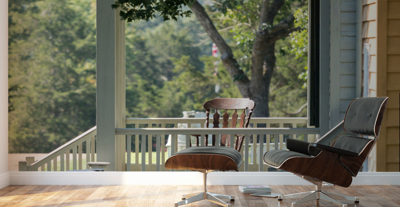 Wooden rocking chair on porch of old house Wall Murals