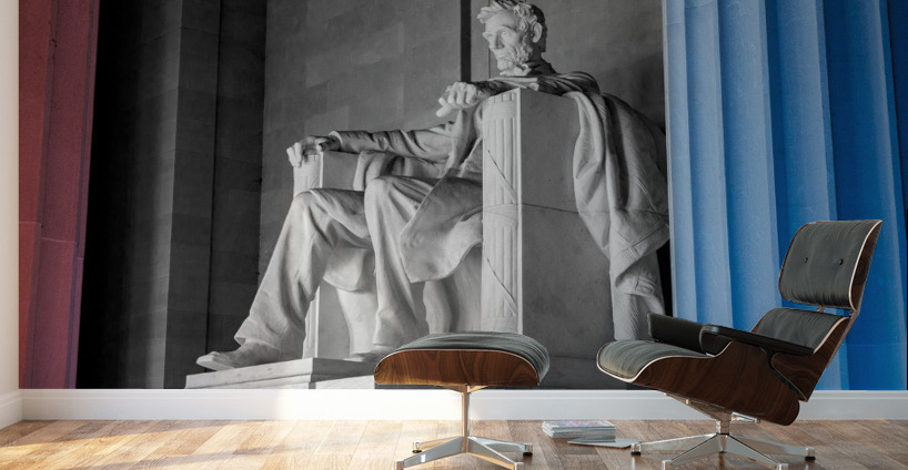 President Lincoln statue with pillars lit in red and blue Wall Murals