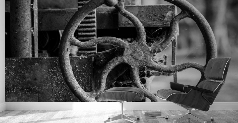 Moss covered farm machinery with handle Wall Murals