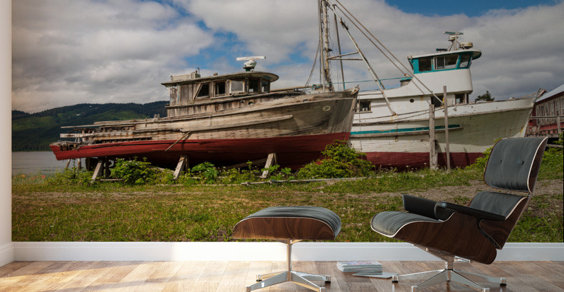 Historic but rotting fishing boats by ocean at Icy Strait Point Wall Murals