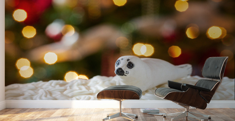 Seal on Christmas cake with tree lights Wall Murals