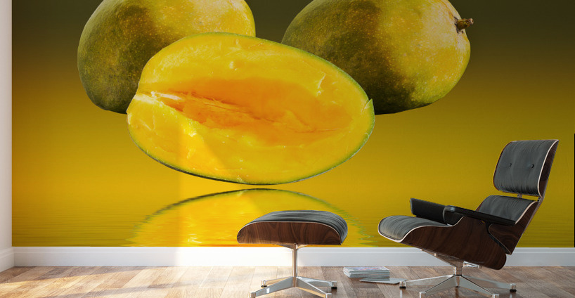 Two mangoes and one cut mango reflecting Wall Murals