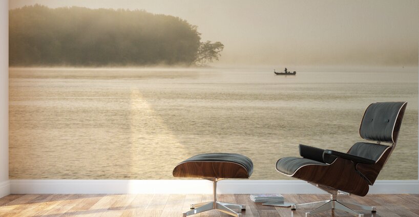 Fisherman fishing in Mississippi river on misty autumn morning Wall Murals