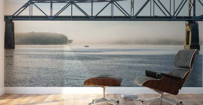 Fisherman fishing in Mississippi river on misty autumn morning Wall Murals