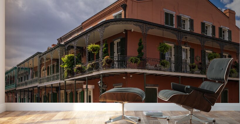 Traditional wrought iron balcony on ochre New Orleans house Wall Murals