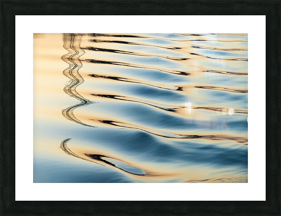 Reflections of electricity pylon at sunset in gentle river rippl Picture Frame print