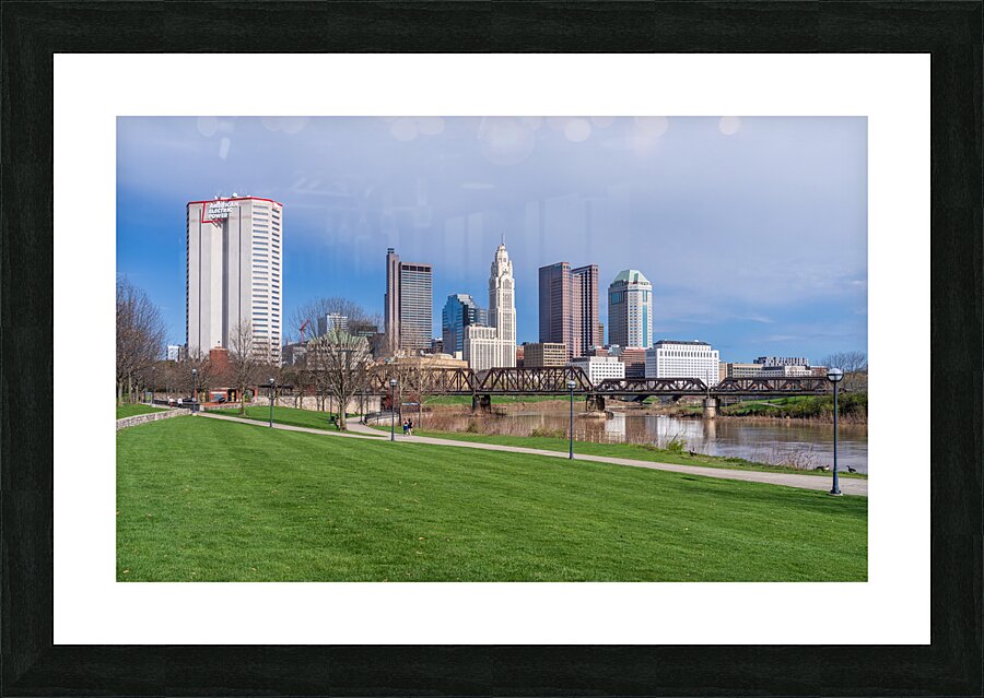 Columbus Ohio waterfront skyline behind railroad truss bridge Picture Frame print
