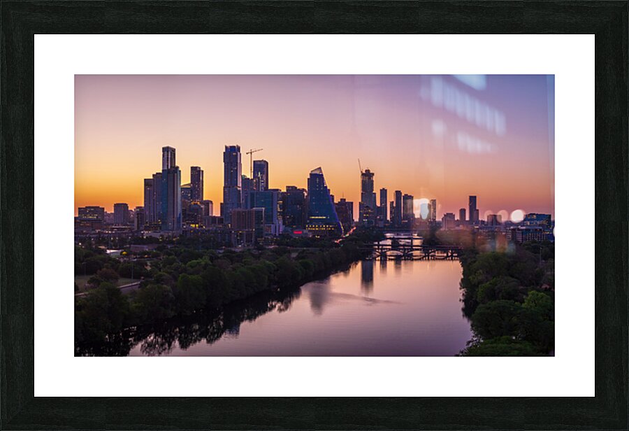 Orange skies behind skyline of Austin Texas as sun starts to ris Picture Frame print