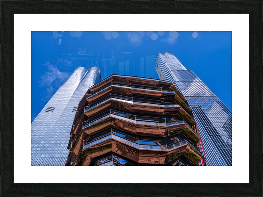 Reflective surface of the Vessel with a skyscraper behind with c Picture Frame print