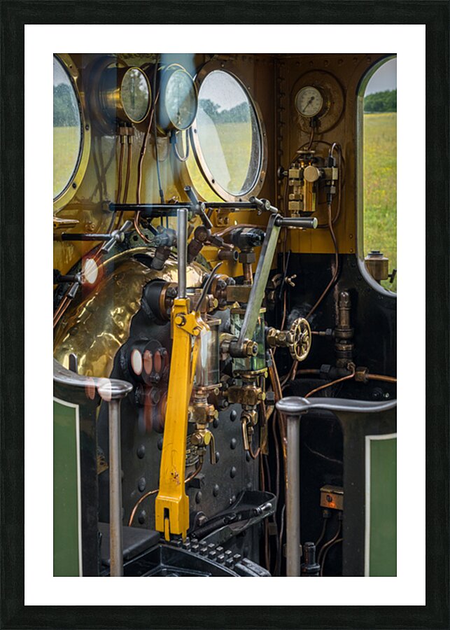 Detail of the driver cabin and controls on an old steam locomoti Picture Frame print
