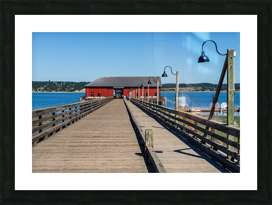 Wooden pier leading to famous red Coupeville wharf on Whidbey Is Picture Frame print