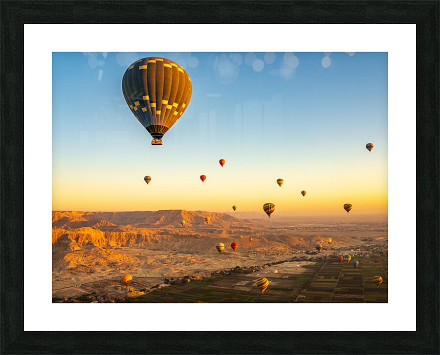 Hot air balloons in sunrise flight over Valley of the Kings in L Picture Frame print