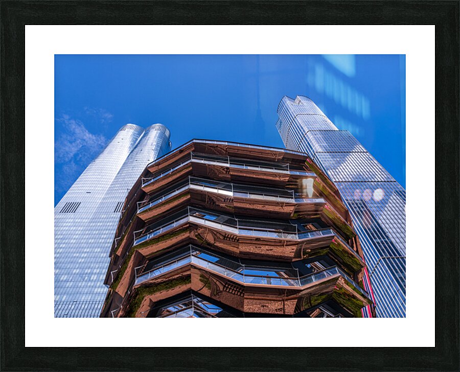 Reflective surface of the Vessel with a skyscraper behind with c Picture Frame print