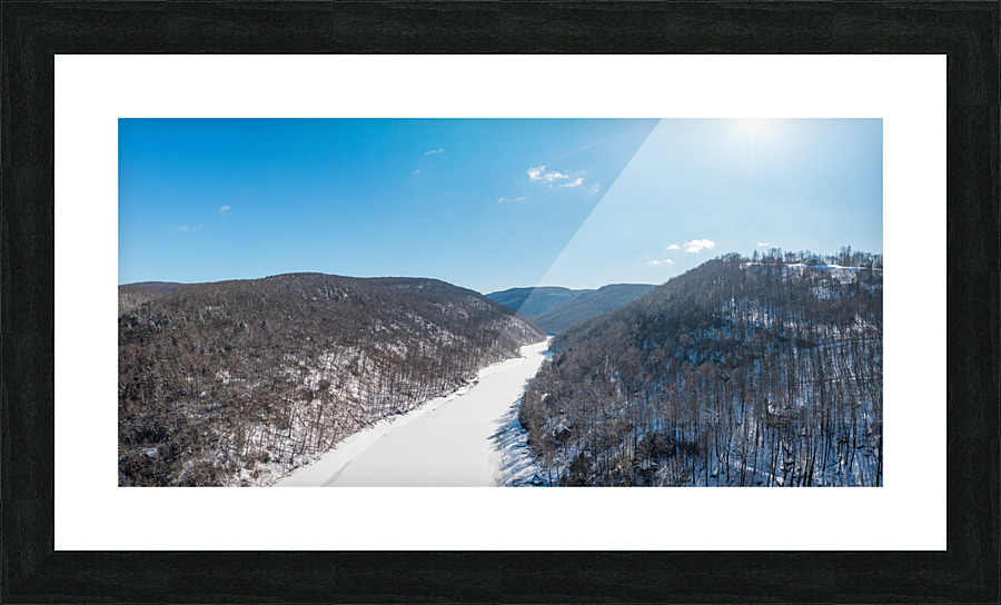 Aerial view up the frozen Cheat River in Morgantown WV Picture Frame print