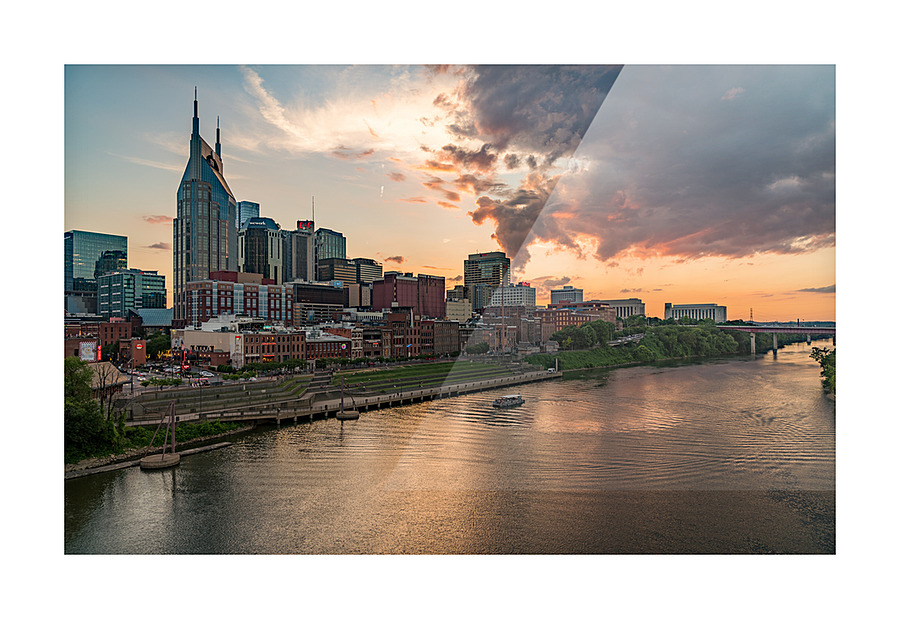 Skyline of Nashville in Tennessee during dramatic sunset over the river Picture Frame print