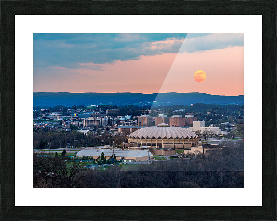 Super pink moon rises above the WVU coliseum on Evansdale campus Picture Frame print
