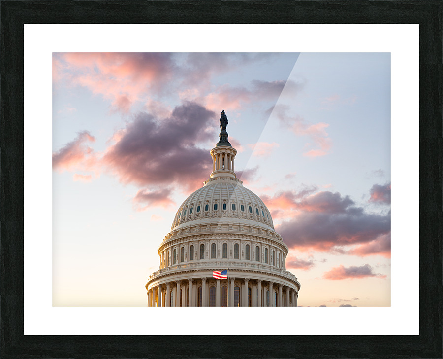 Flag flies in front of Capitol in DC at sunrise Picture Frame print